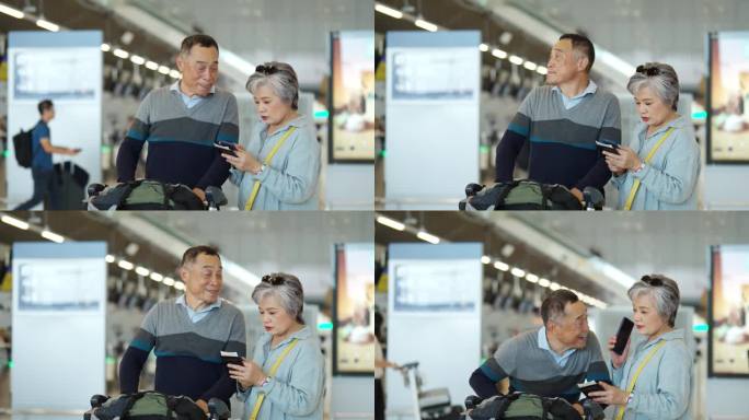 4K亚洲老年夫妇推着行李车一起走在机场候机楼。