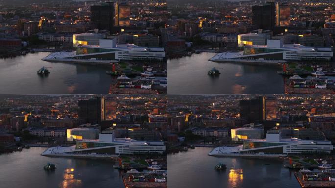 挪威歌剧院和芭蕾舞团在海滨的现代白色建筑鸟瞰图。日落时分的城市建筑。挪威奥斯陆
