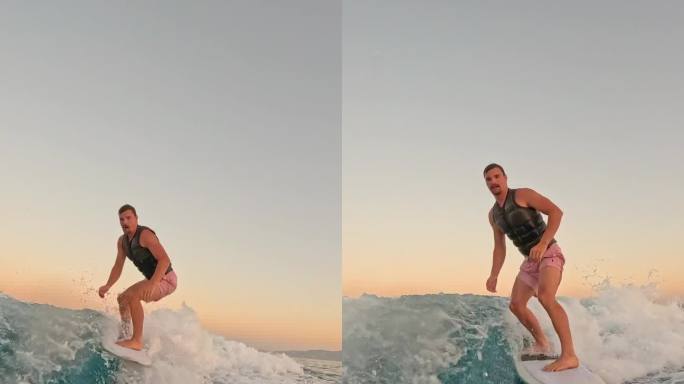 SLO MO男子享受日落滑水，离开绳索，用快乐的动作溅起海水