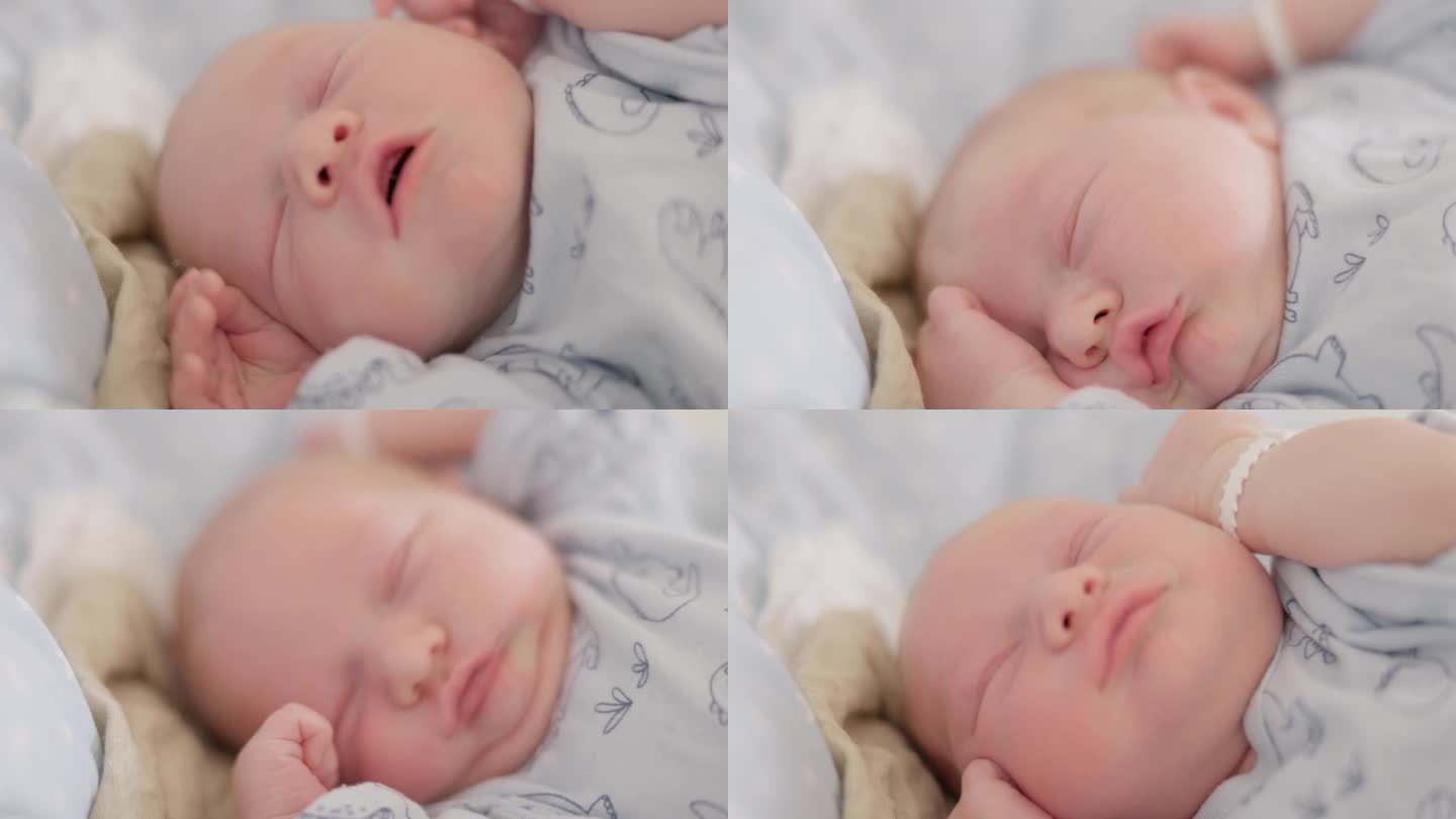 可爱的新生男婴在医院产房睡觉时伸展身体的特写镜头