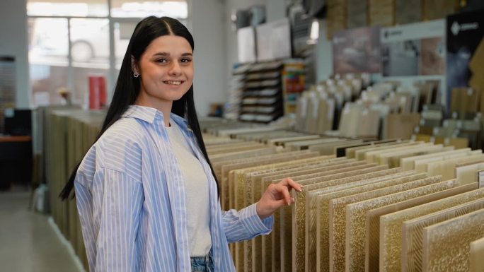 Portrait of woman with ceramic tiles in a hardware