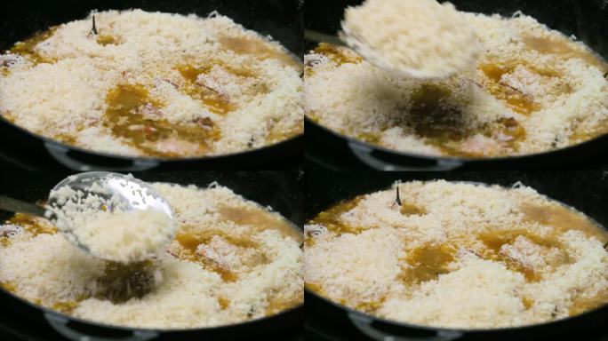 在户外用铸铁锅做饭。煎洋葱。4k视频片段UHD 3840x2160