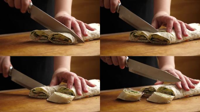 皮塔饼裹在卷里，切成小块。准备一卷奶酪，鱼和蔬菜。缓慢的运动。