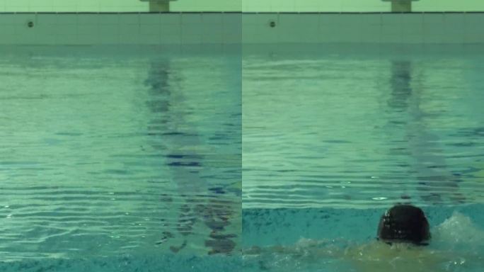 一个戴着帽子和护目镜的白人运动员正在泳池里游蛙泳。垂直视频
