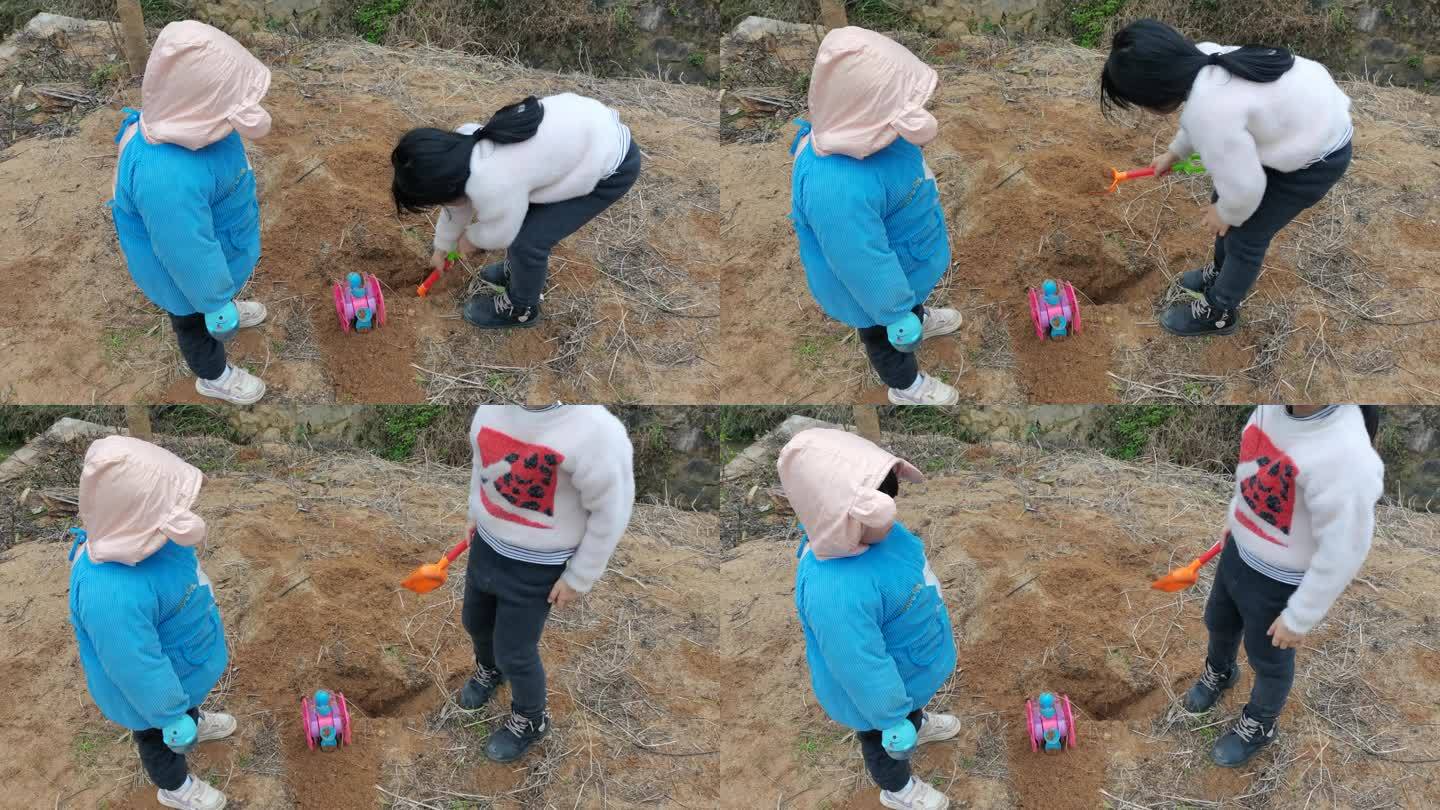 小孩玩沙堆