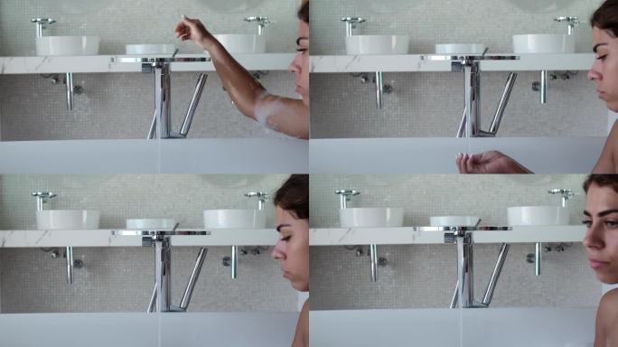 女人在浴室用肥皂洗手。特写镜头。