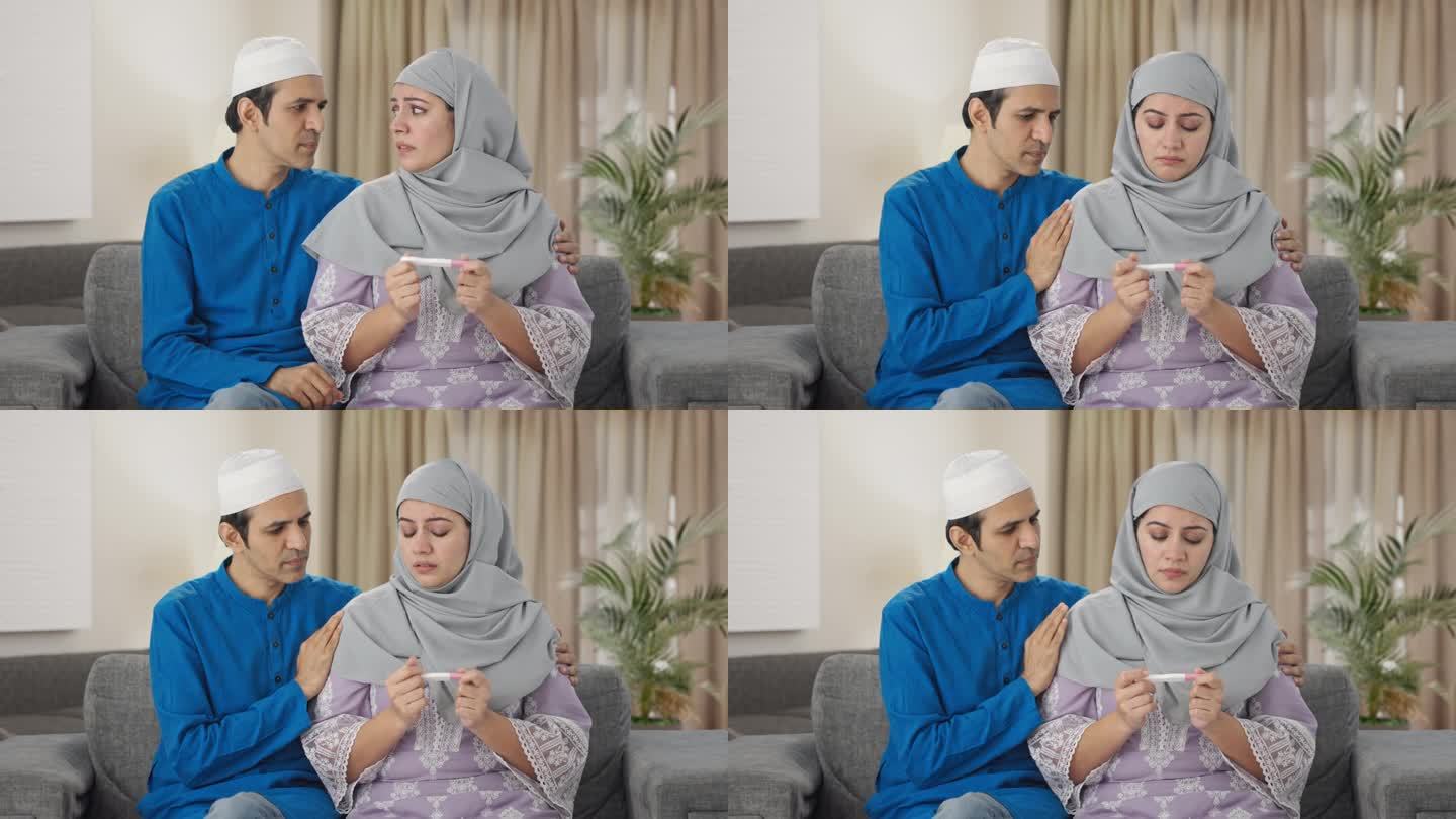 可怜的穆斯林夫妇正在检查验孕棒