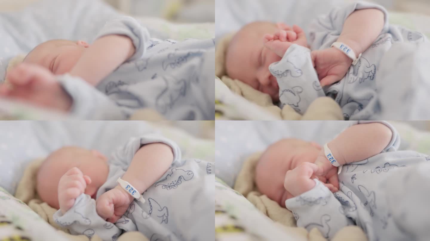 在妇产医院，刚出生的男婴躺在婴儿床上伸懒腰