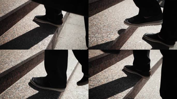 商人的脚走上石阶。慢镜头，阳光明媚的一天。商人的黑色裤子和靴子。