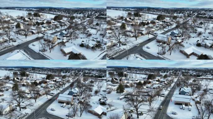美国的圣诞节。美国小镇冬季航拍景。暴风雪过后，五颜六色的房子和光秃秃的树。
