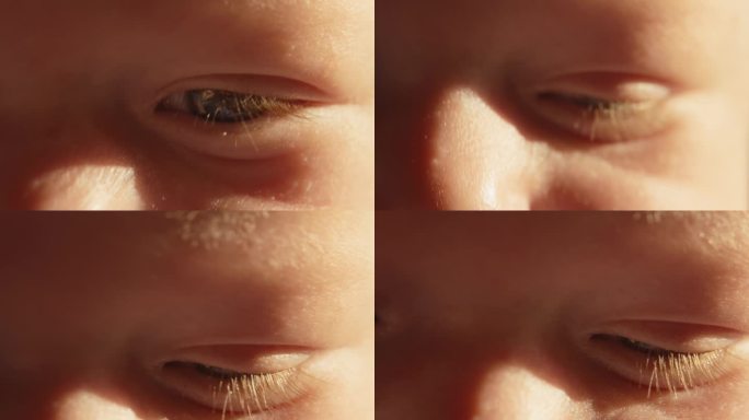太阳亲吻婴儿男孩的眼睛的极近镜头全画幅拍摄