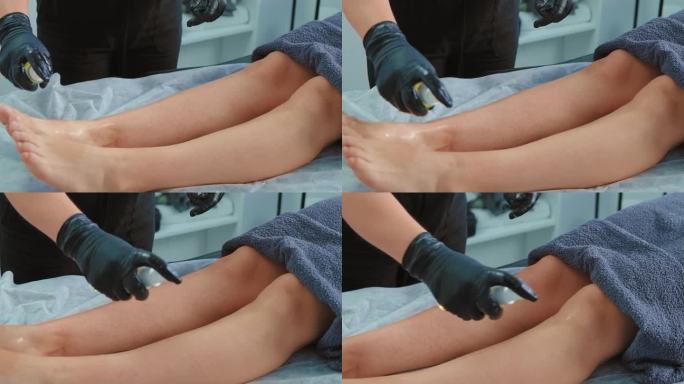 一名女子在美容诊所的糖化手术后，为病人的腿涂抹皮肤再生喷雾乳液