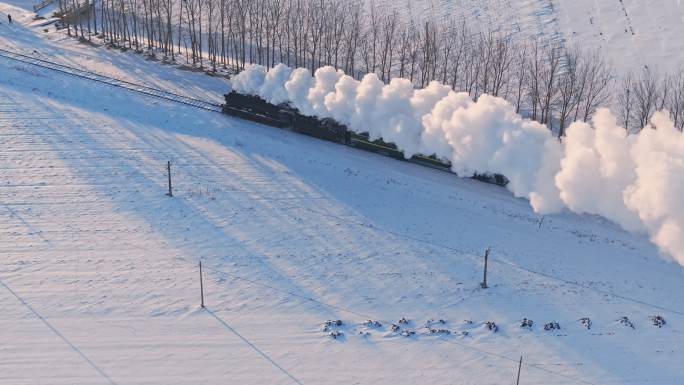 航拍中国东北冬季雪景中的蒸汽机车老火车