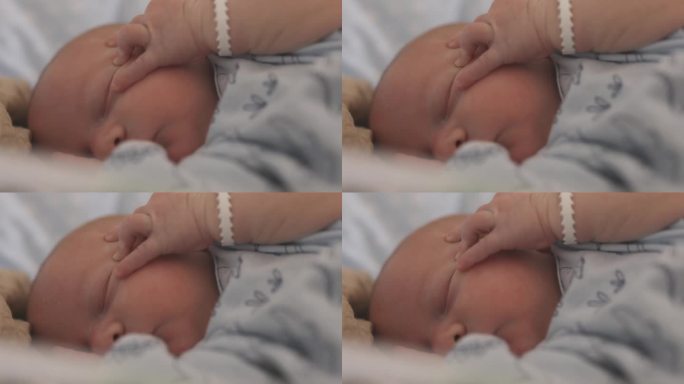 可爱的新生男婴在医院产房睡觉的特写镜头。5天大的婴儿