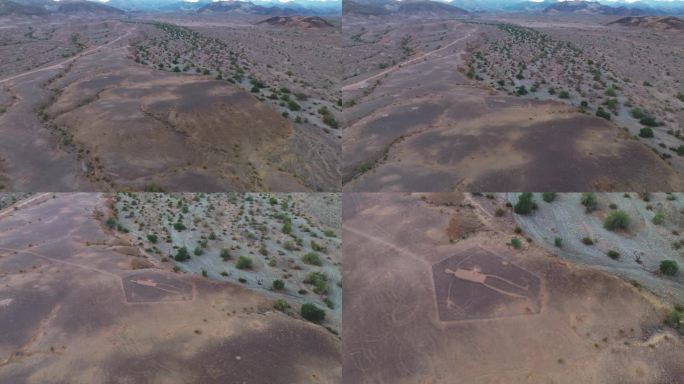 广阔的沙漠广阔揭示古代凹版绘制地形，无人机镜头以上的地形与山和天空前面
