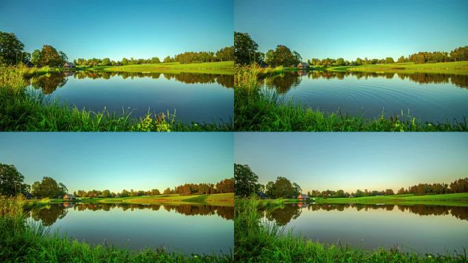 当白天变成蓝色时，树影越过池塘和草地的平滑时间流逝