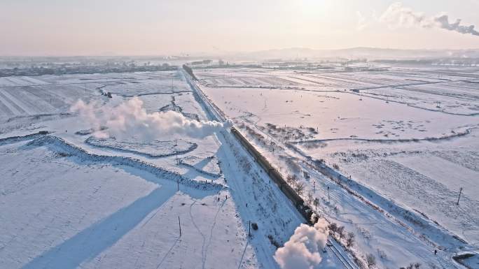 航拍中国东北冬季雪景中的蒸汽机车老火车