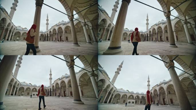 戴头巾的妇女走进苏莱曼清真寺庭院#清真寺之旅#苏莱曼清真寺庭院