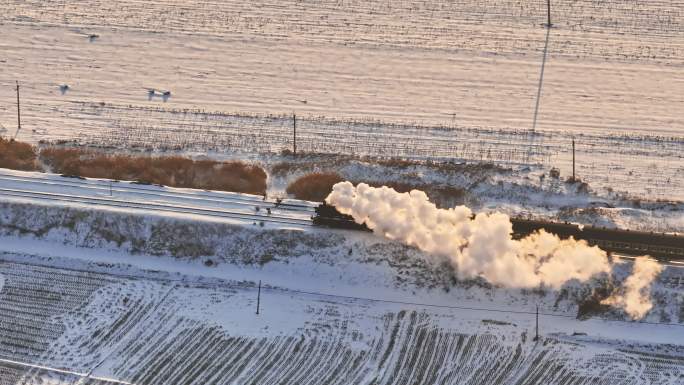 航拍中国东北冬季雪景中的蒸汽机车老火车