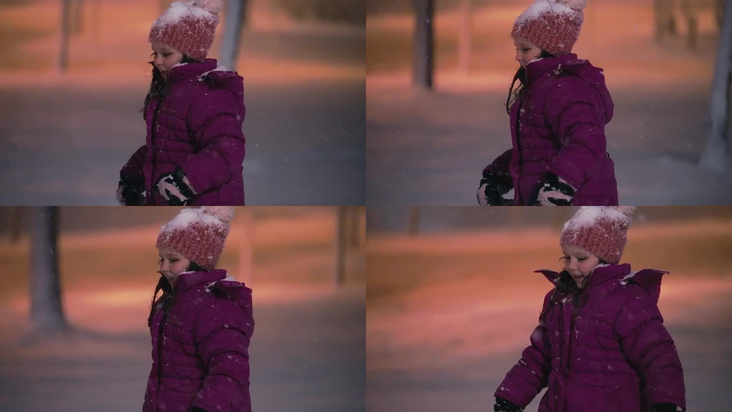 穿着紫色夹克的快乐少女在公园里漫步，夜雪飘飘