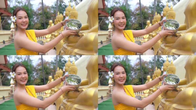 泰国泼水节期间，一位美丽的年轻女子正在进行沐浴仪式。