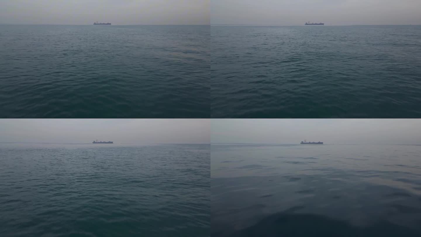空中飞向海上的一艘货船4k库存视频