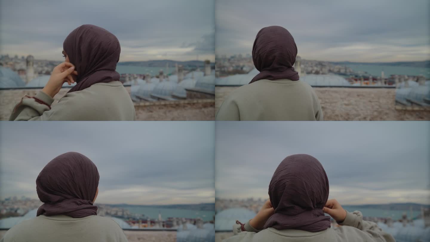 城市的宁静:戴着头巾的年轻女子从屋顶俯瞰伊斯坦布尔的天际线