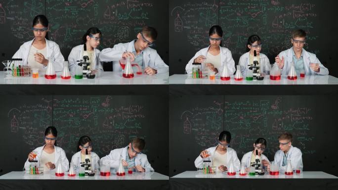 聪明的多元学生在STEM课堂上做黑板体验。启迪