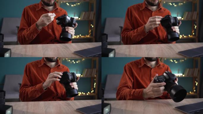 摄影师在他的家庭办公室插入或取出专业相机的存储卡的特写。