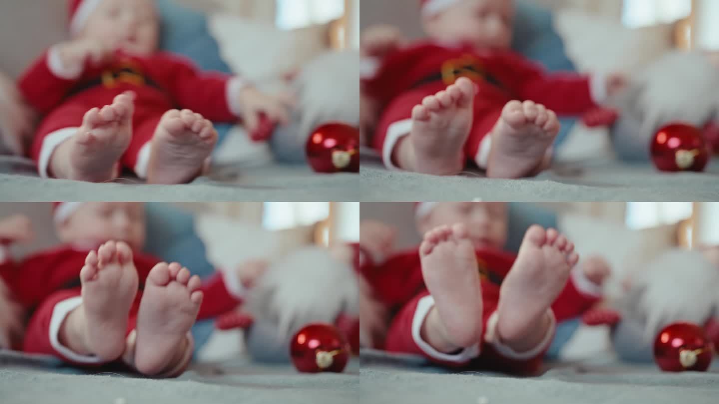 手持拍摄的宝宝在沙发上玩红色小玩意，重点是赤脚在家里