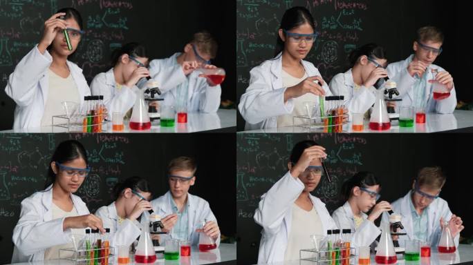 可爱的女孩在显微镜下看着学生做实验。启迪