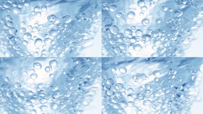 超级慢动作拍摄的油和水的蓝色漩涡在1000fps。
