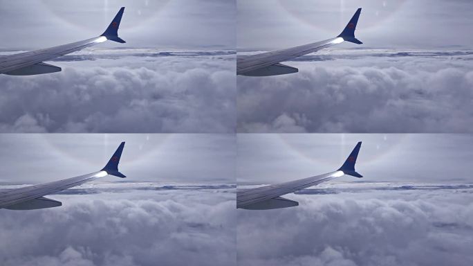 在飞机上穿过云层和光晕