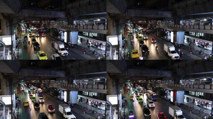 现代都市，泰国曼谷，城市街道上车辆和行人的交通，BTS地铁列车在高速公路和人行天桥上行驶。现代都市生
