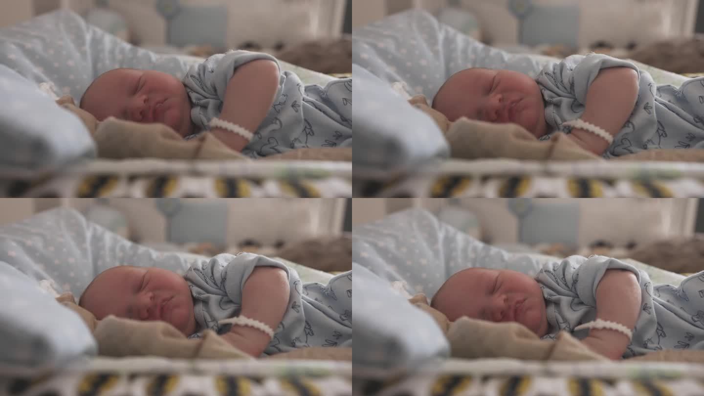 可爱的新生男婴在妇产医院的婴儿床上睡觉的特写镜头。一个5天大的婴儿