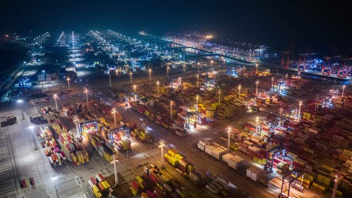 中国浙江宁波港口集装箱码头航拍夜景延时