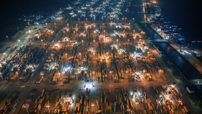 中国浙江宁波港口集装箱码头航拍夜景延时