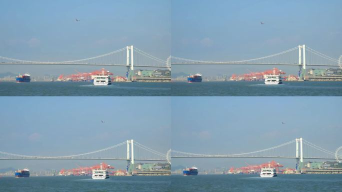 福建厦门海沧大桥下的轮船和空中的飞机航班