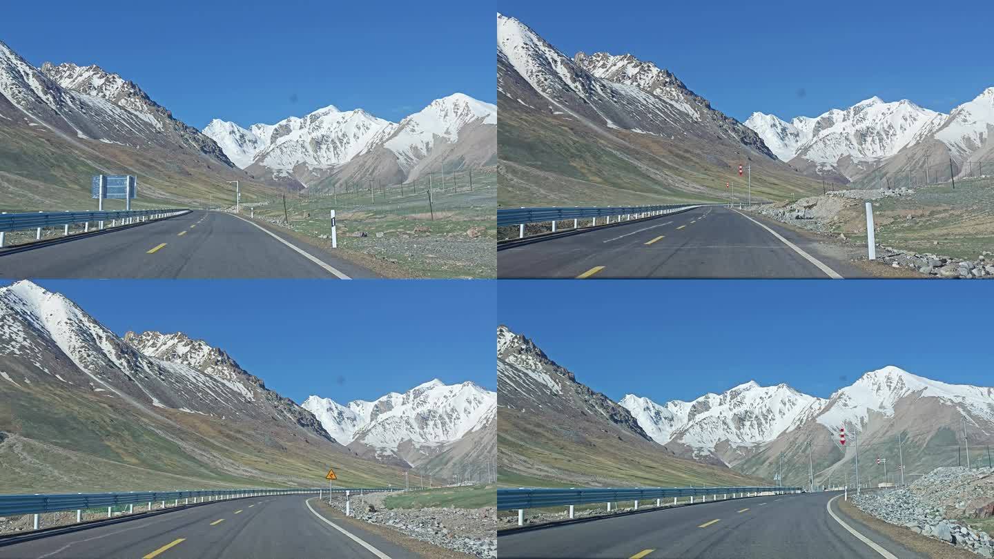 汽车在新疆雪山公路上行驶车内视角