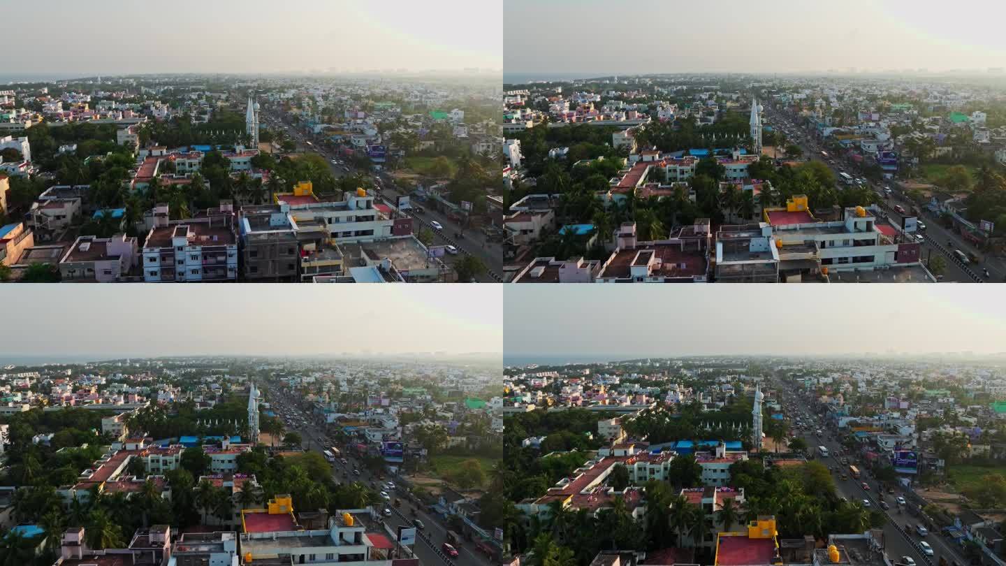 视差无人机拍摄的城市金奈与繁忙的道路在印度下午。