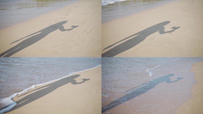 旅游博主用专业相机在沙滩上拍摄影子。内容创作者拍摄海滨散步，捕捉海边的氛围。网红的剪影带着器材，海浪