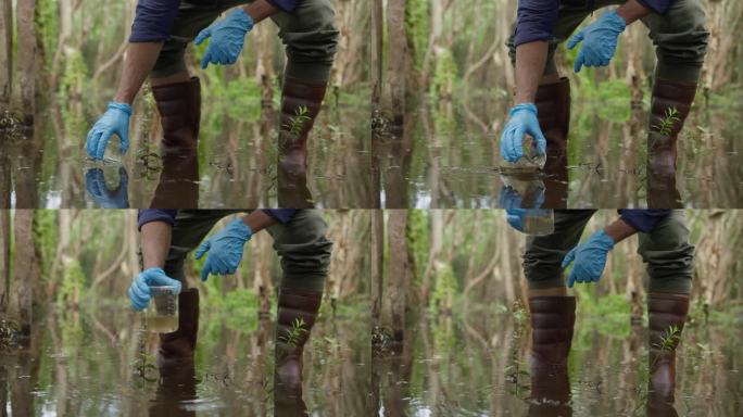 一位年轻的生物学家在泥炭地收集水样，以检查污染物并测量矿物质的丰富程度。