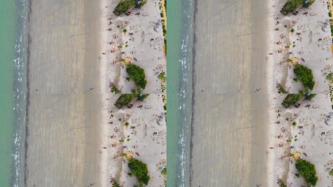 退潮的海浪卷着小木船冲进海滩。风景优美的空中俯瞰在亚洲，孟加拉国