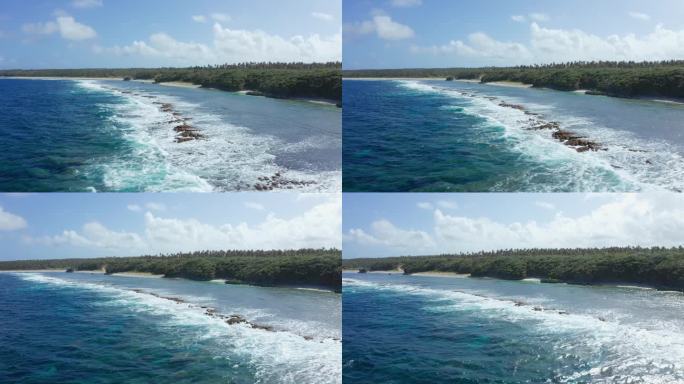 汤加、大洋洲。无人机拍摄的绿色海岸，沙滩和南太平洋海浪