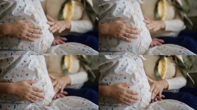 一个等待新生儿的孕妇的腹部特写