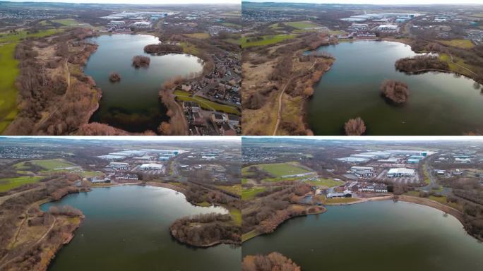 4K空中无人机镜头飞行整个长度的曼弗斯湖滨水区船俱乐部，迪尔恩谷信托，迪尔恩湖，罗瑟勒姆，南约克郡，