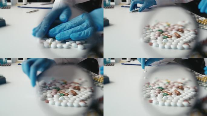 实验室研究人员用镊子拿着药片，把质量差的样品收起来