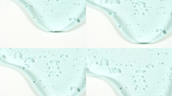 化妆品凝胶流体与分子气泡流动在纯白色背景。液体乳霜凝胶。天然有机化妆品、药品微距拍摄。生产特写。缓慢