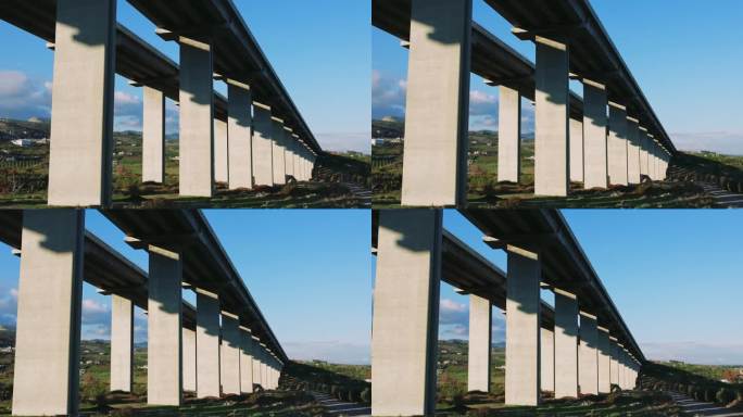 混凝土山地高速公路高架桥的无人机视图。汽车、高架桥交通畅通。风景优美的汽车、高架桥置身于大自然之中。