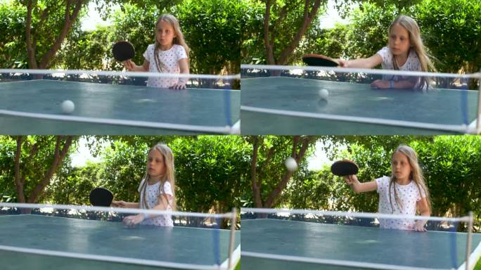 漂亮的情感女孩打乒乓球在绿色的背景